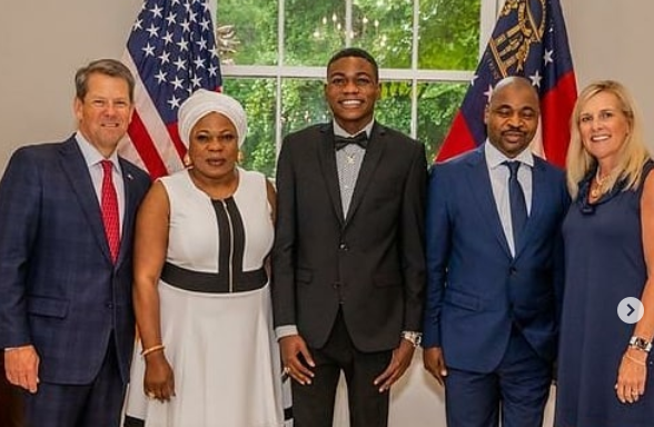 MC Oluomo and son with the Governor of Georgia and his family