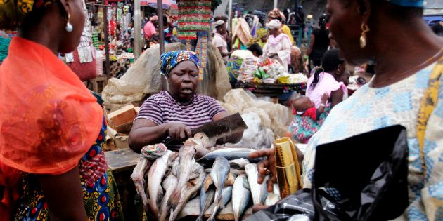 a fisherman's wife selling fish in Makoko