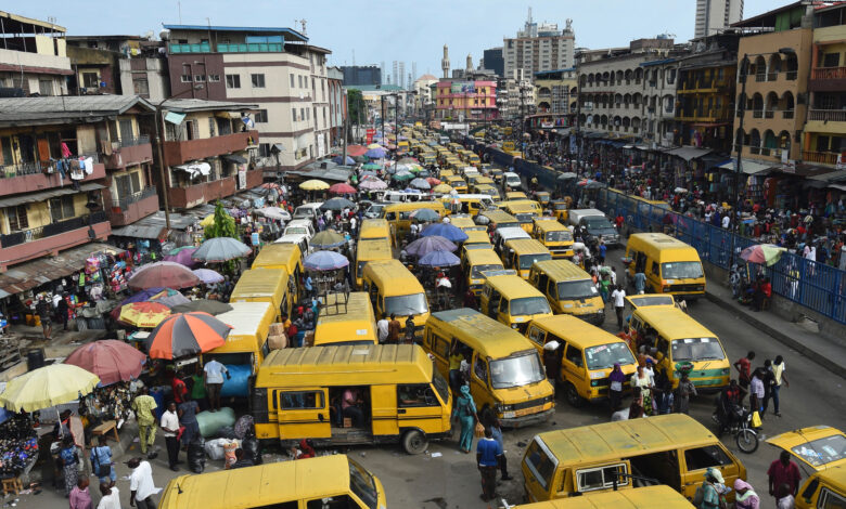 Public transport minibuses painted in bright yellow colour popularly called "Danfo" barricade the roads in search of passengers and causing traffic gridlock at Idumota in Lagos on May 10, 2017. AFP PHOTO / PIUS UTOMI EKPEI (Photo credit should read PIUS UTOMI EKPEI/AFP/Getty Images)