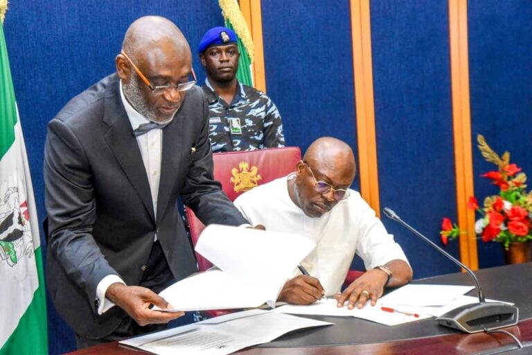 Siminalayi Fubara signing a document