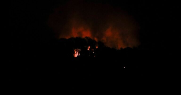 Smoke rises over Caracas after reported strikes as Venezuela accuses the United States of military aggression.