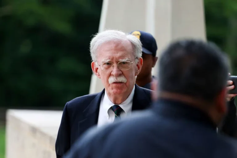 Former White House national security adviser John Bolton arrives at the US District Court